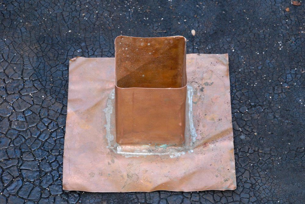 Copper flashing for a post on a flat roof
