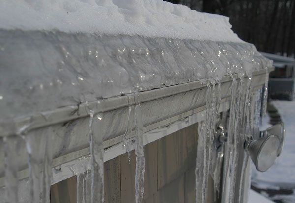 During winter gutters freeze. The ice blocks the water from getting to the gutter creating a dam of water on the roof. This will force the water into the roof under the shingles.