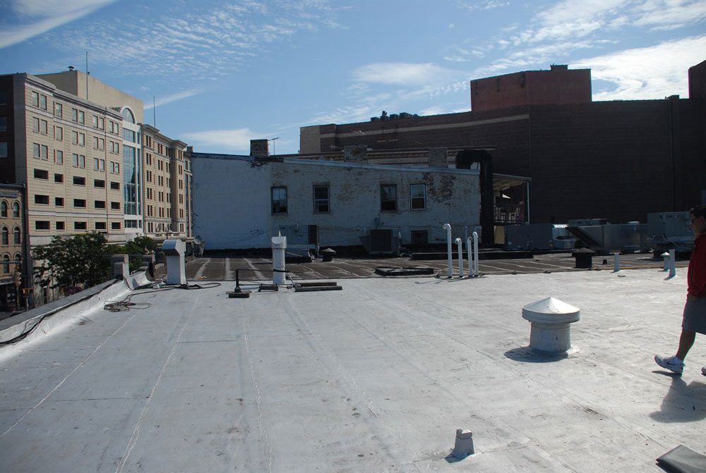 A good example of a well maintained Torch Down roof - They kept painting it with silver coating so the membrane itself was never exposed to ultraviolets