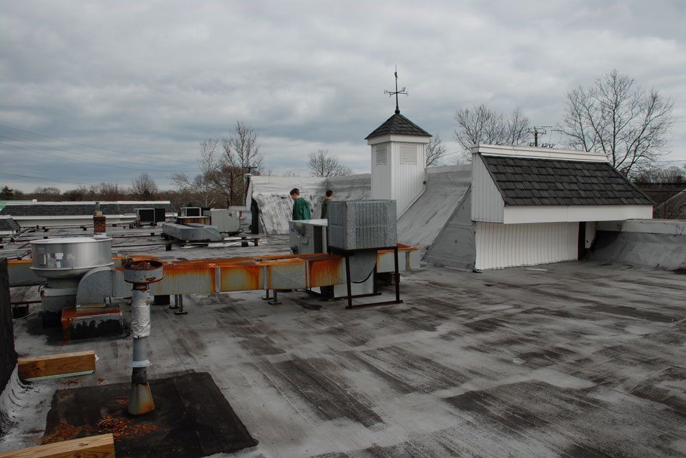 The silver coating or Aluminum Asphalt paint has worn off. This roof is due for a new coating