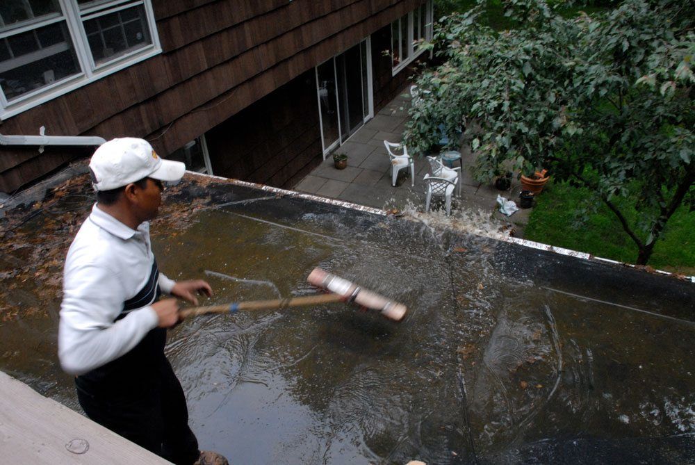 Standing water on an EPDM flat roof- pooling water will disintegrate the adhesives bonding the seams