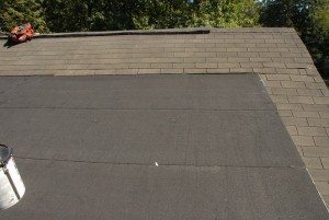 Shingle to a flat roof transition. Rubber Roof Repair - Shingles Transition to Rubber Membrane - Kansas