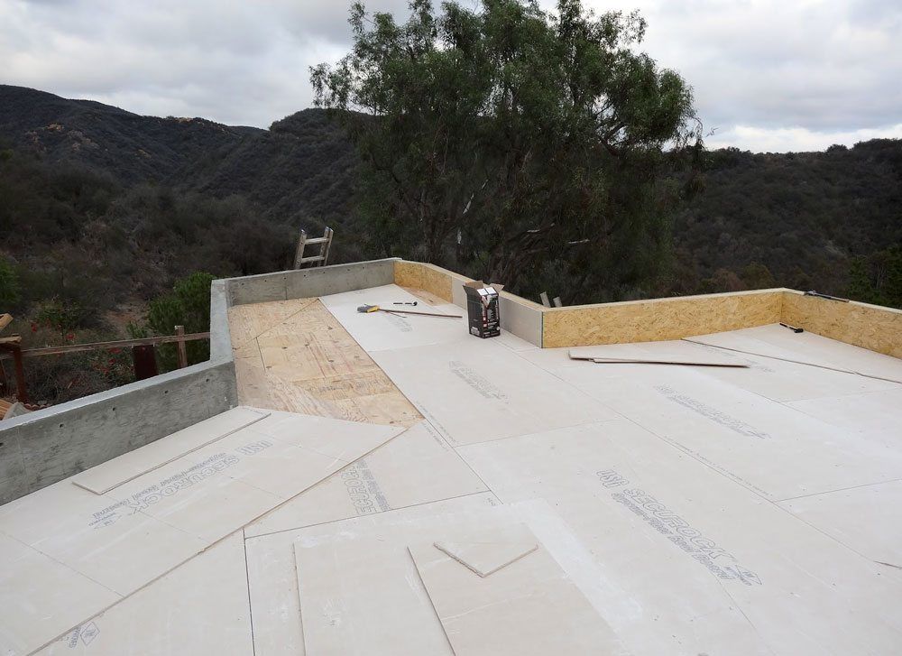 Flat roof Los Angeles - Fire protected cement board is installed over plywood
