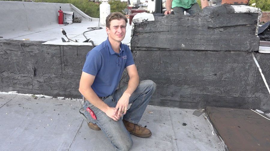 Chimneys and walls are smeared with tar for leak protection in Brooklyn and Manhattan.