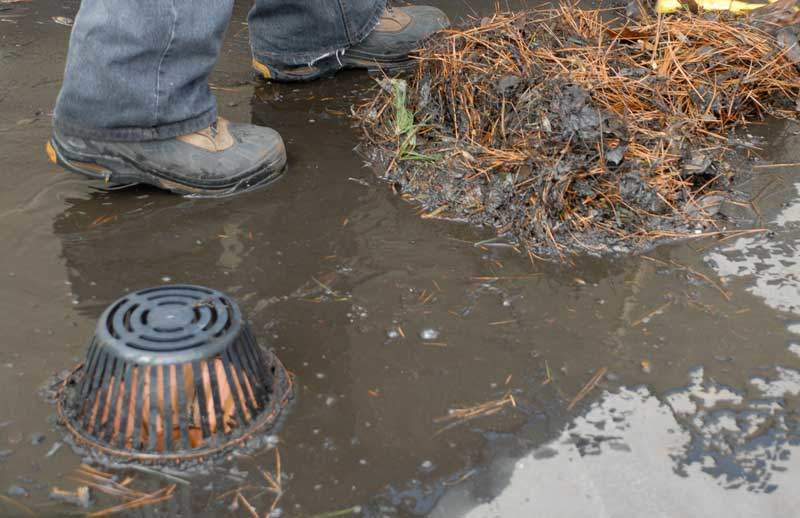 Debris around a strainer and drain will eventually clog drains up