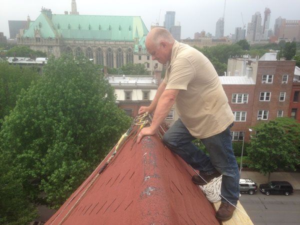 Watching Andre repair flashing on a chimney in Brooklyn, NY.