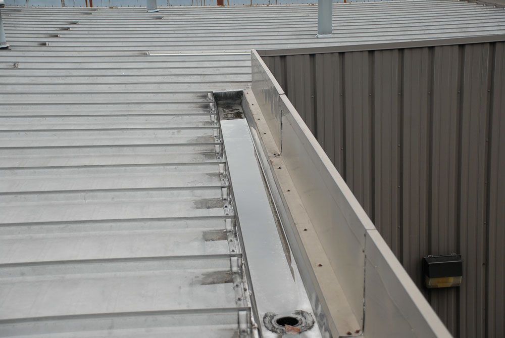 Metal-roof-Gutter - Flat Roof Repair