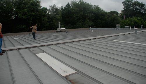 Commercial Flat Roof - Metal roofs systems can be repaired.