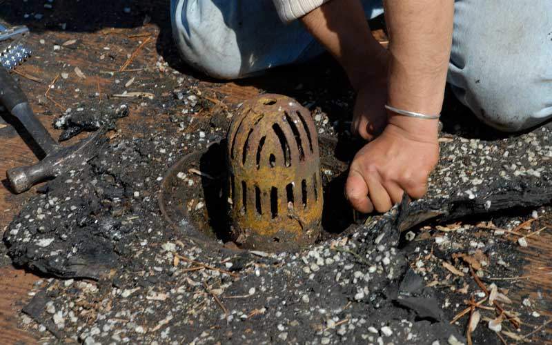 A Cast Iron Basin Drain from the 1930s - basin is too small and the strainer holes and slots are too small an narrow.