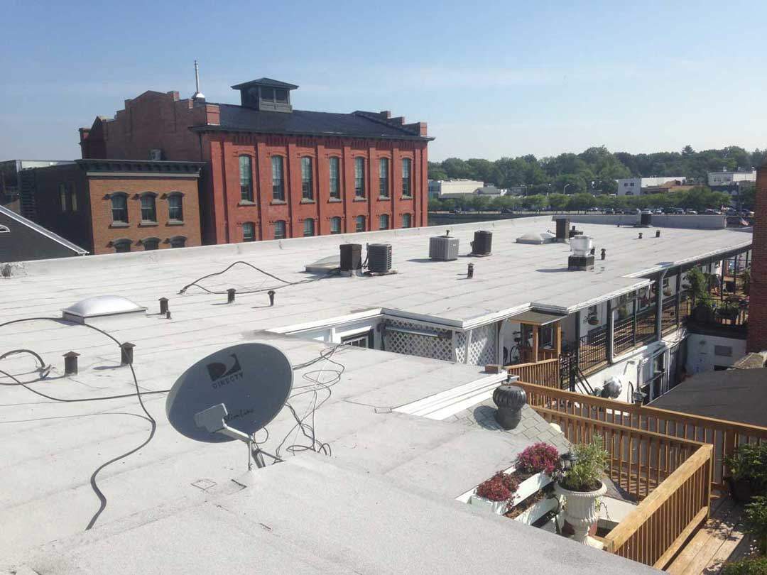 Rubber Roof Installation over a tar and gravel commercial roof