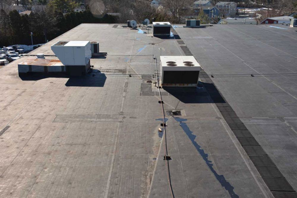 EPDM Rubber on a Commercial roof in Westport CT - The seams are starting to separate due to adhesive failure