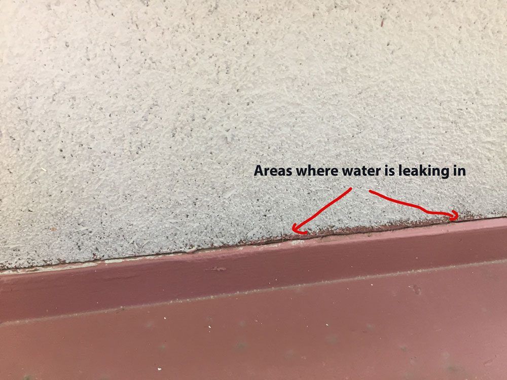 flashing on wall causes leaks on a flat roof
