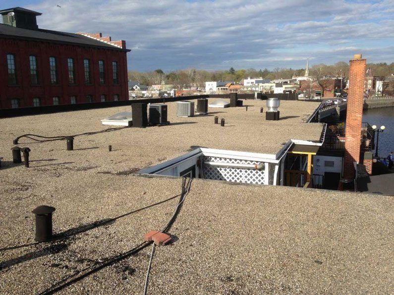 Flat Roof Repairs -Hot Tar and gravel roofs often needs repairs due to their age. New Canaan, Westport, CT