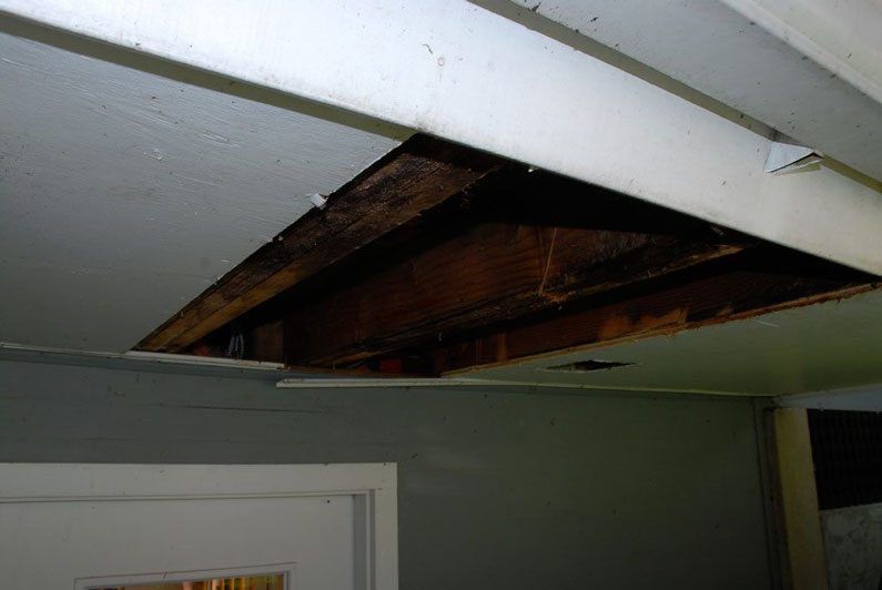 Damaged ceiling from Post Railing leak
