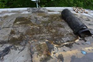 After cutting the roof open, water was under the roofing membrane