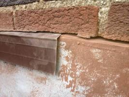 Flat Roof Repair - Counter Flashing on a brick wall - Cutting a slot into the brick wall to insert metal flashing. This is what counter flashing is