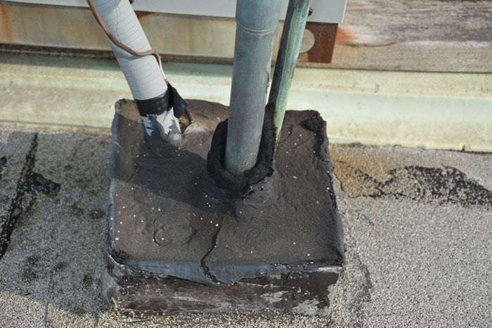 An Example of a Pitch-Pocket -Flat Roof Fixing a Pitch-Pocket on a flat roof. Make sure it is filled with tar to the brim