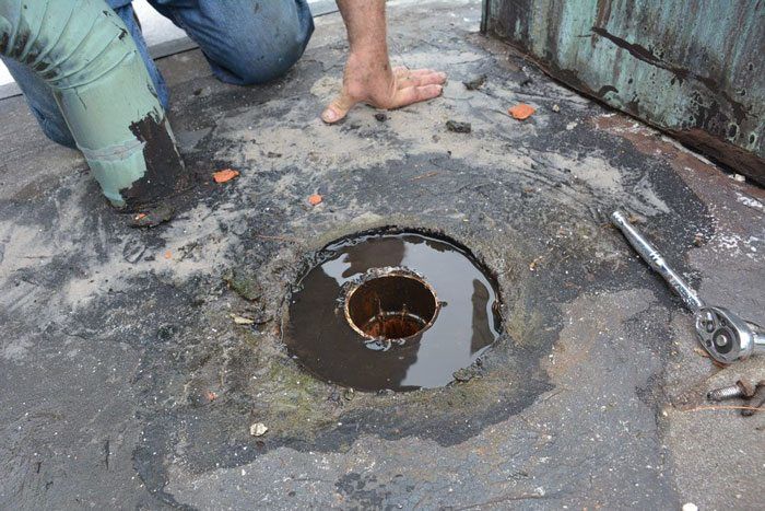 Flat Roof repair - Membrane is not attached to drain and caused leaks