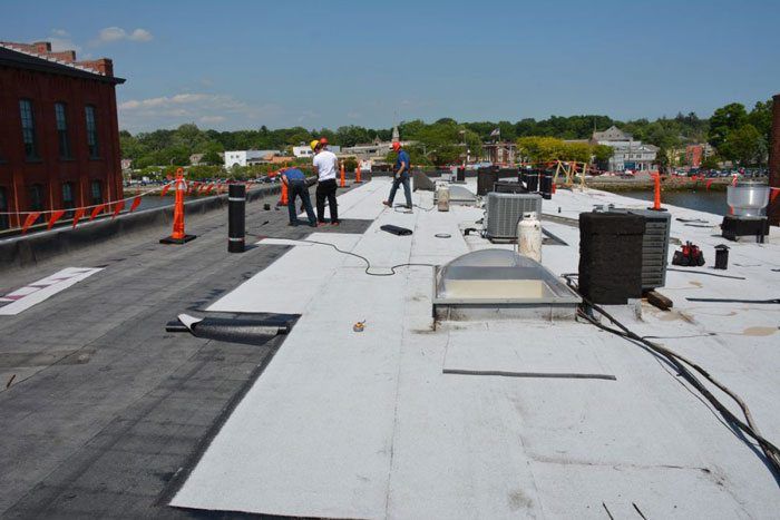 How to Fix a flat roof - This is a roof in CT, PA, TX, NY, CA, Westport - It is a Torch Down Rubber membrane over Tar and Gravel