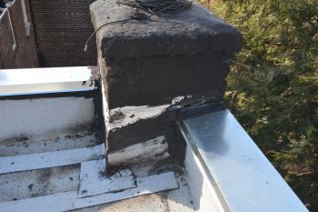 Chimney is not properly flashed on a flat roof repair-Queens NY