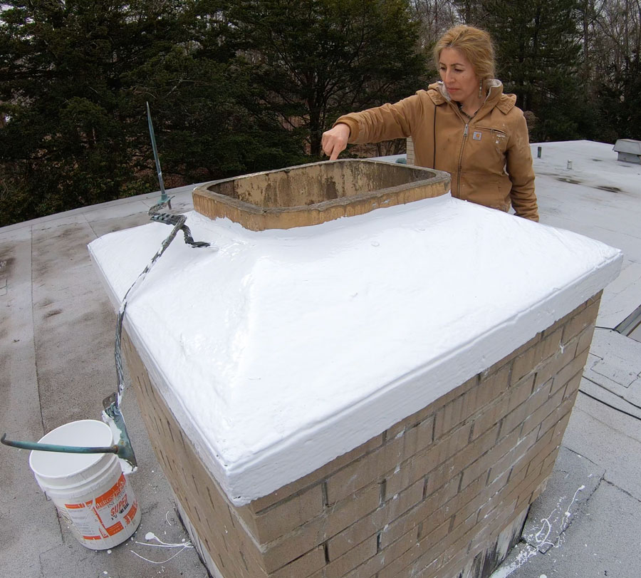 A chimney cap being coated with Super Silicone Seal