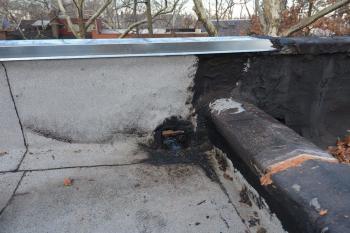 Scupper on Flat Roof full of tar - To repair, remove old tar to the copper and make a new transition - Queens, NY